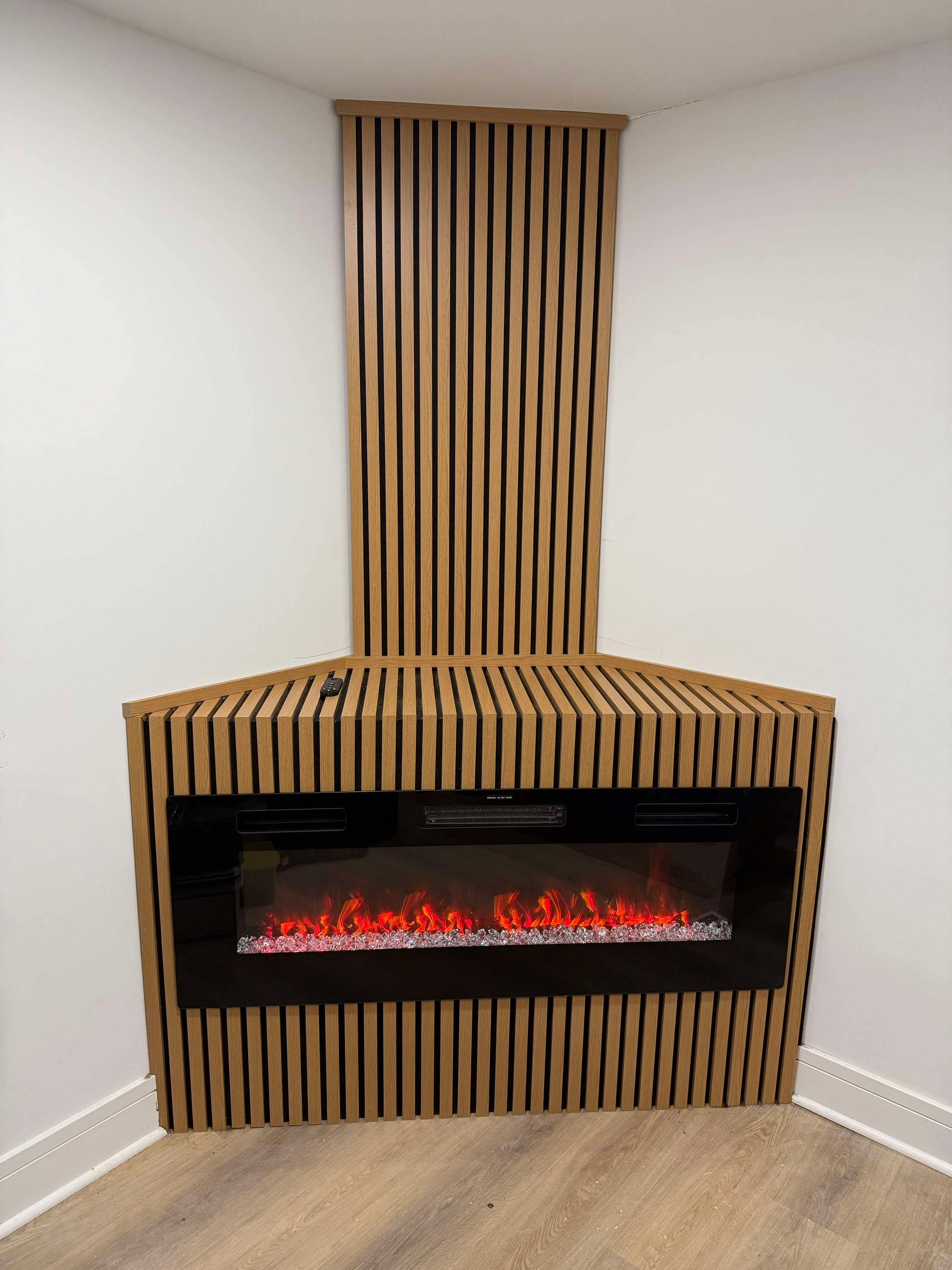 Corner feature wall with vertical wood slats and electric fireplace