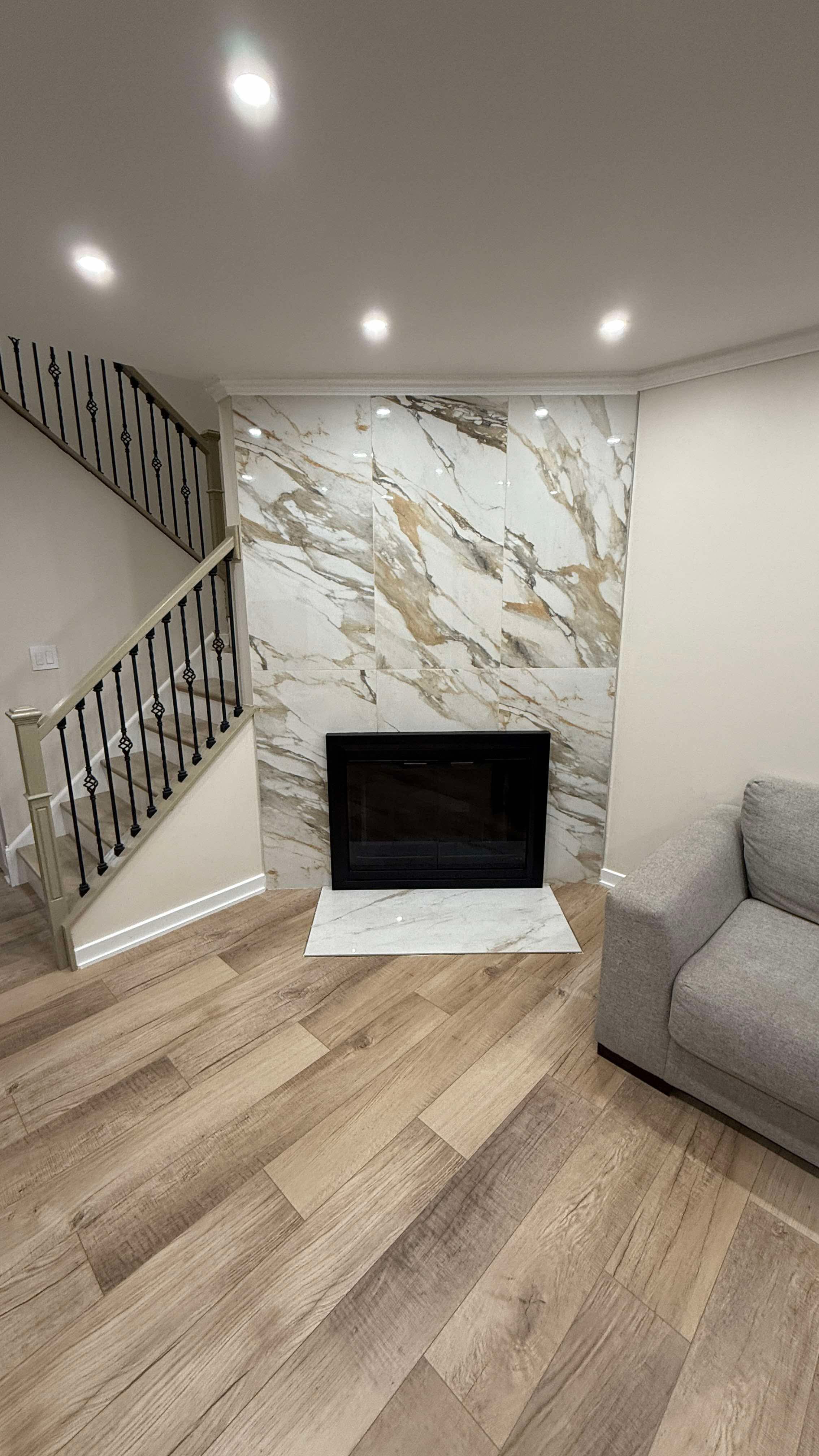 Fireplace wall with large porcelain tiles